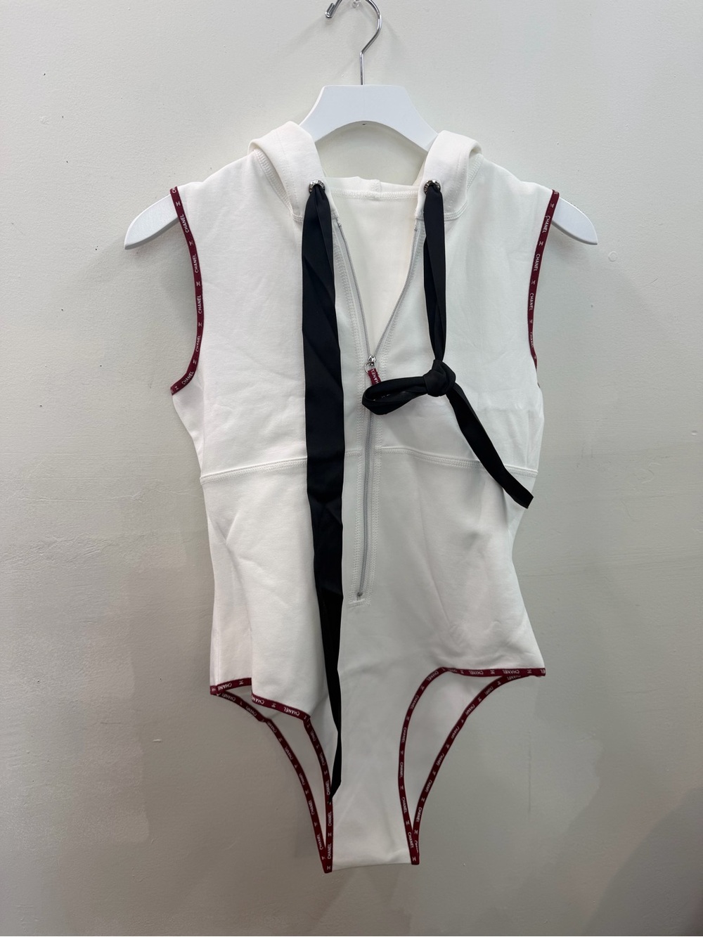 CHANEL White Hooded Sleeveless Bodysuit with Black Tie and Wine Trim